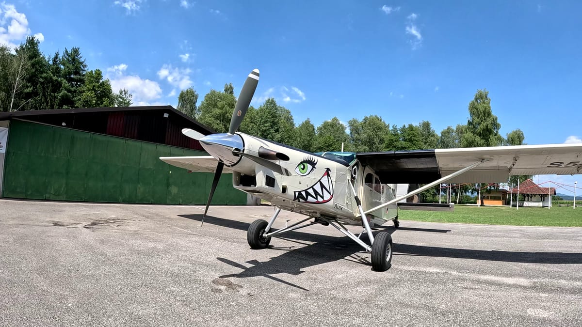 Pilatus Porter aircraft at the Metlika dropzone in Slovenia, used for skydiving operations.