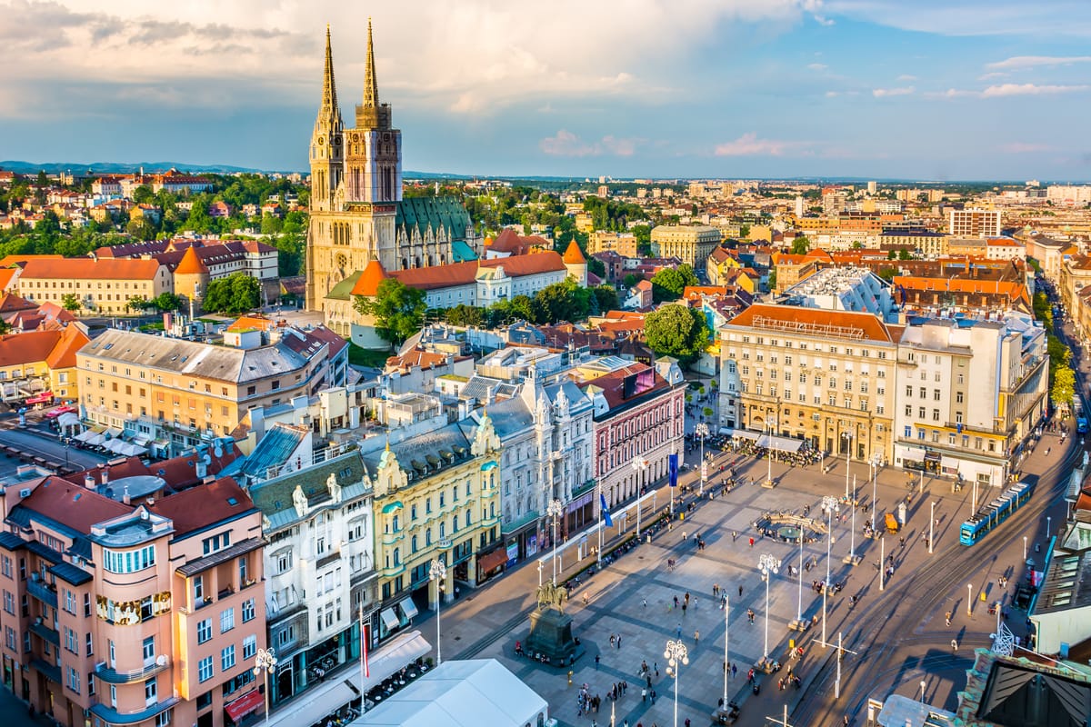 Aerial view of Zagreb city center with Ban Jelačić Square and Zagreb Cathedral surrounded by historic buildings, Croatia.